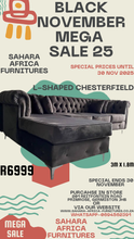Load image into Gallery viewer, Advertisement for Sahara Africa Furnitures with a black L-shaped Chesterfield sofa, promotional text, and contact information.
